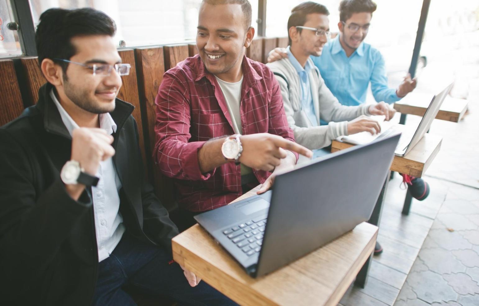 Business acquisition classroom setting with students learning valuation techniques